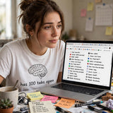 Lifestyle woman wearing my-brain-has-100-tabs-open tee at messy desk with laptop tabs open ADHD relatable - lifestyle extra