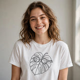 Lifestyle woman wearing plant-parent-vibes-funny-monstera-sunglasses-tee tee with monstera plant with sunglasses one-line art